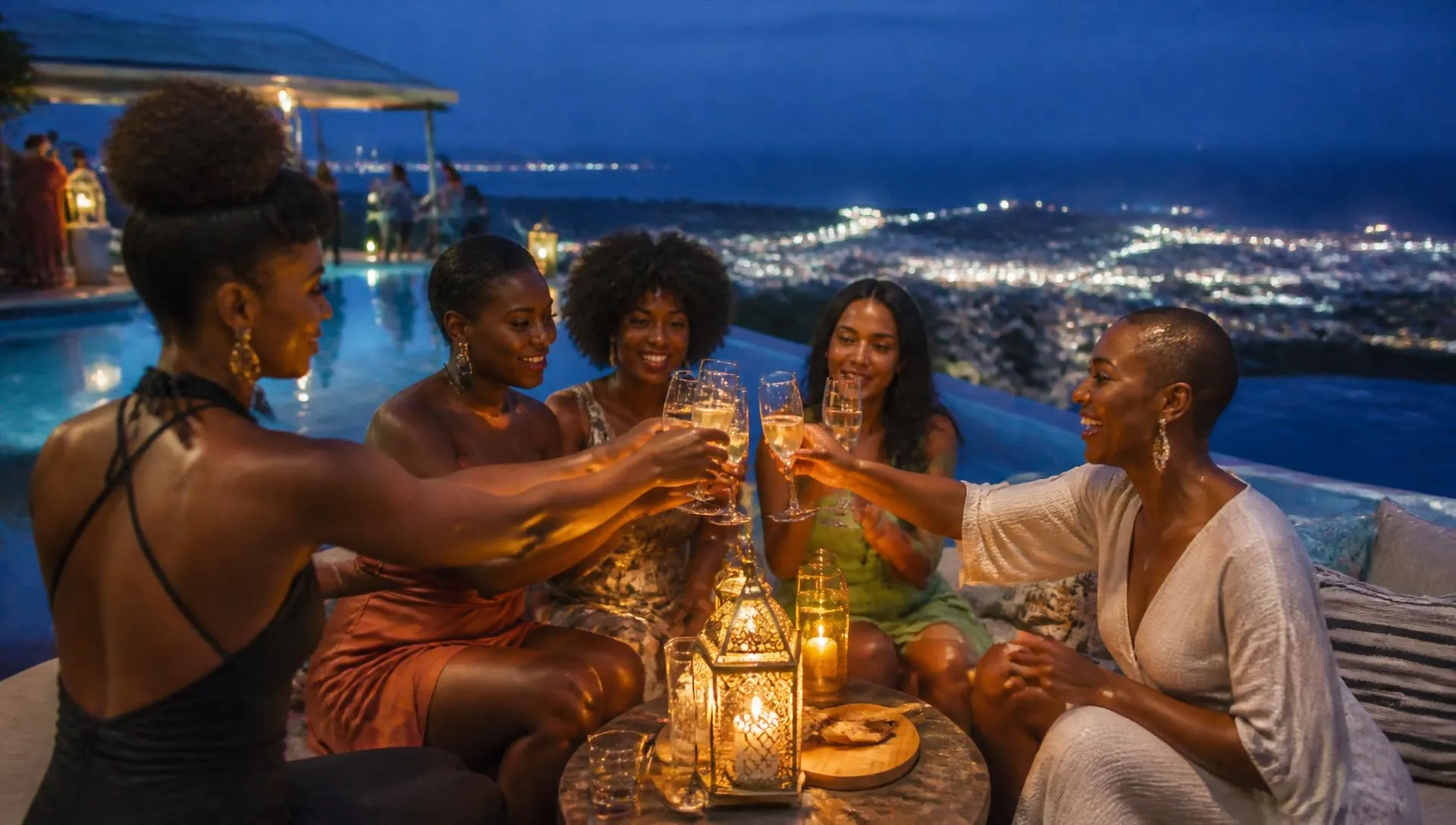 Friends toasting with champagne on a lantern-lit infinity-pool terrace overlooking city lights at blue hour